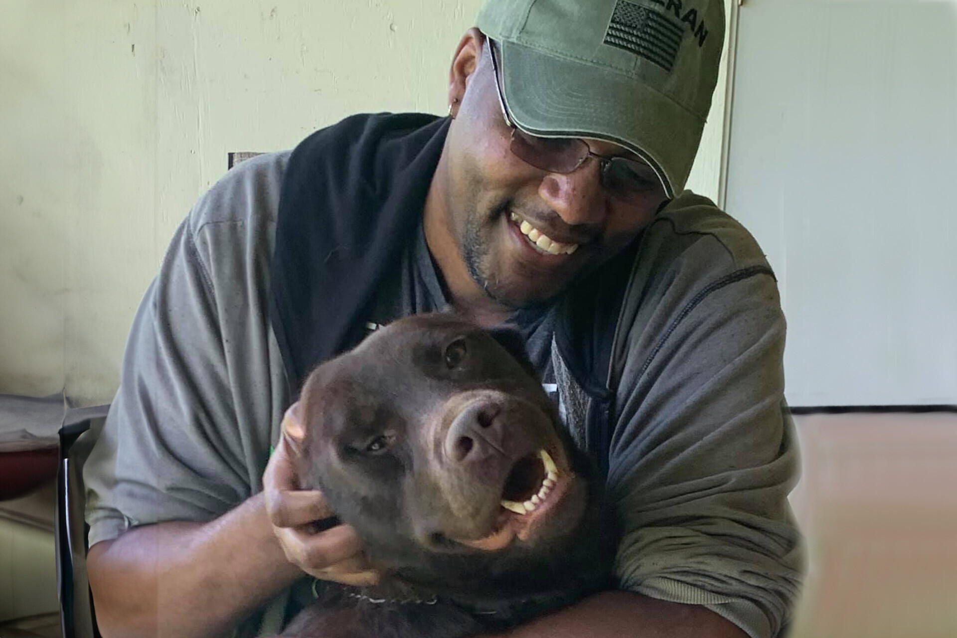 Photo of DL and his PTSD service dog, Atlas