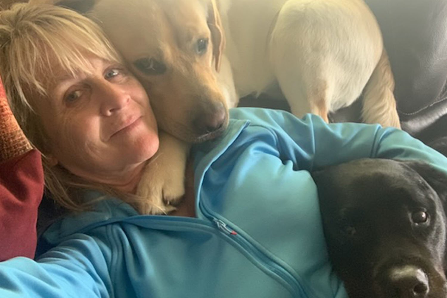 Shannon Walker with her English Lab Caliber and another black lab