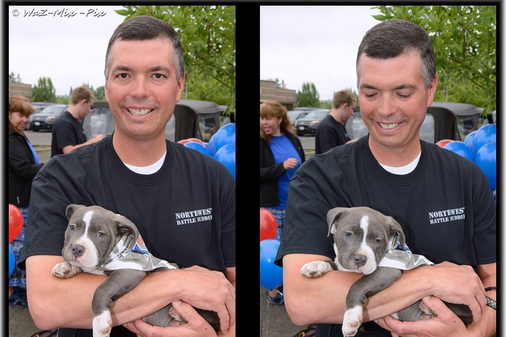 Eric Atwell holding a boxer puppy