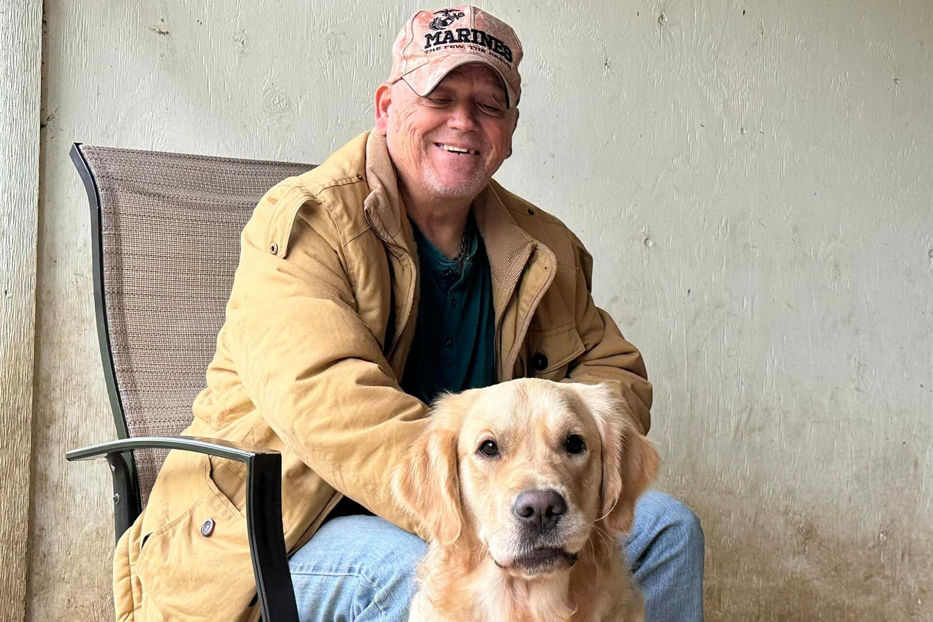 Photo of a Marine Veteran with his PTSD service dog